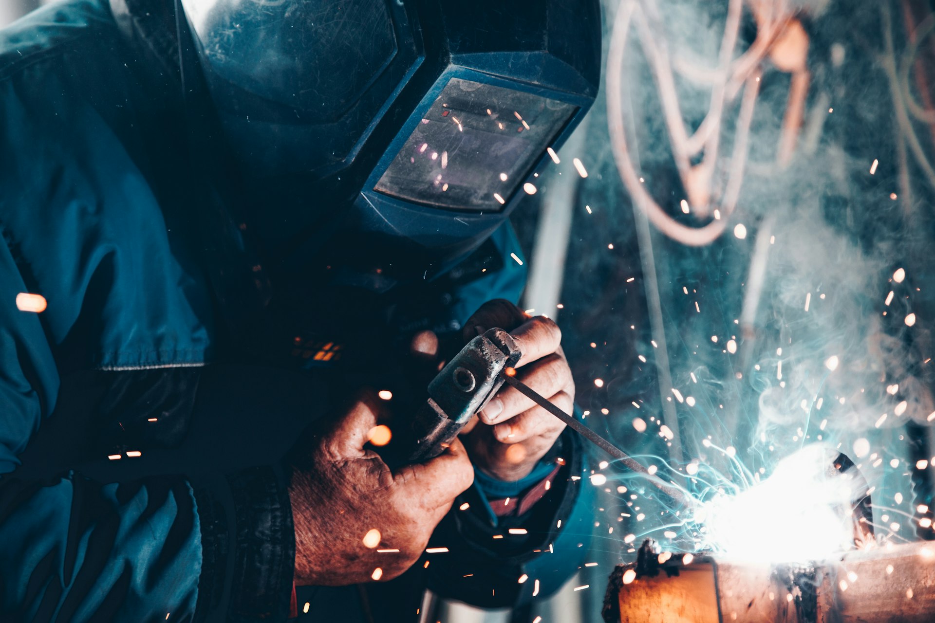 Pakistani tradesmen at work in Turkey - welder, electrician and machine technician on-site